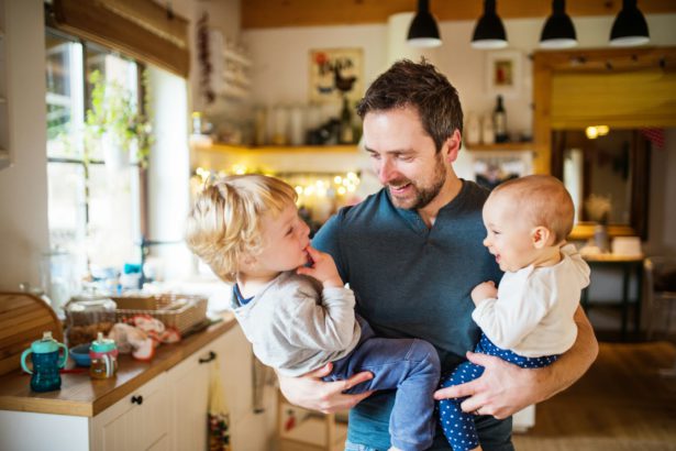 Father with two toddlers at home.